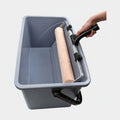 Gray paint bucket with a roller and handle on a white background