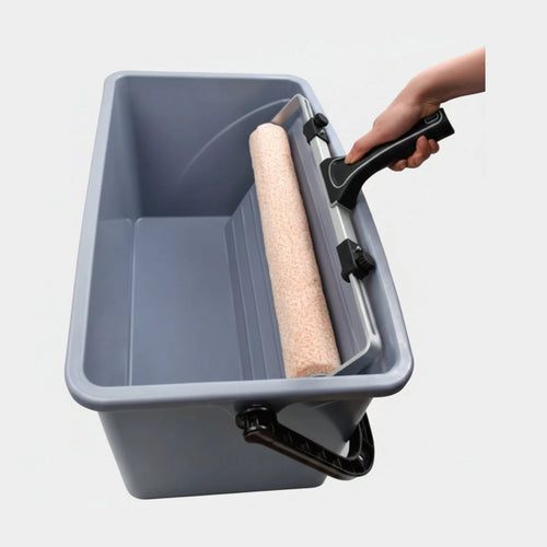 Gray paint bucket with a roller and handle on a white background