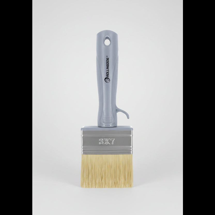 Paint brush with a gray handle and wooden bristles, featuring the brand 'Rollinghog'.