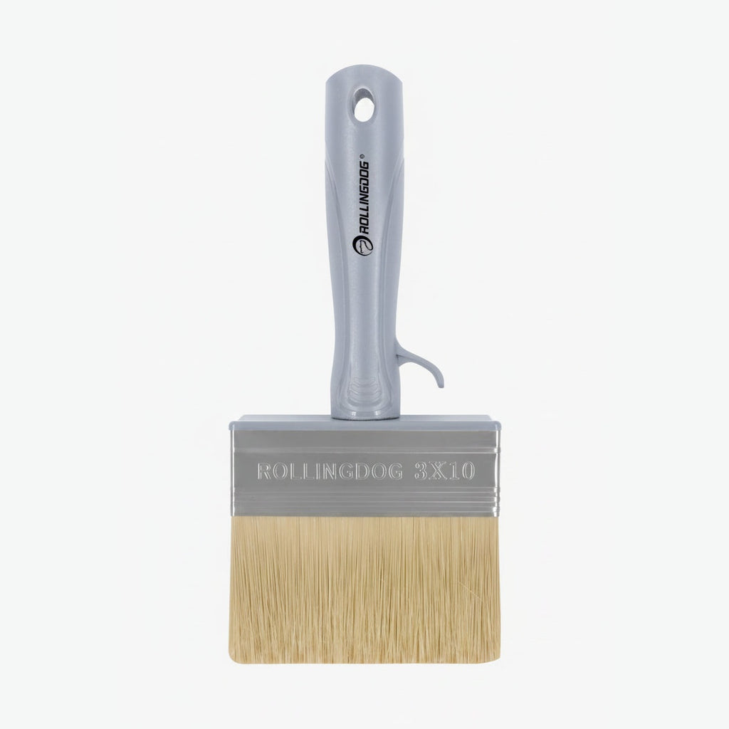 Paint brush with a gray handle and beige bristles on a white background